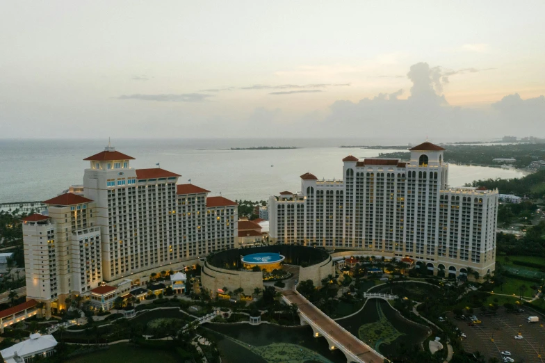 a large building next to a body of water, by Robbie Trevino, hotel room, high view, 8k octan advertising photo, bahamas