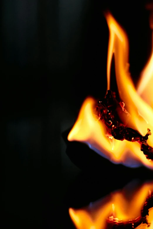 a close up of a lit candle on a table, by John Murdoch, engulfed in flames, photographed for reuters, a brightly colored, ap art