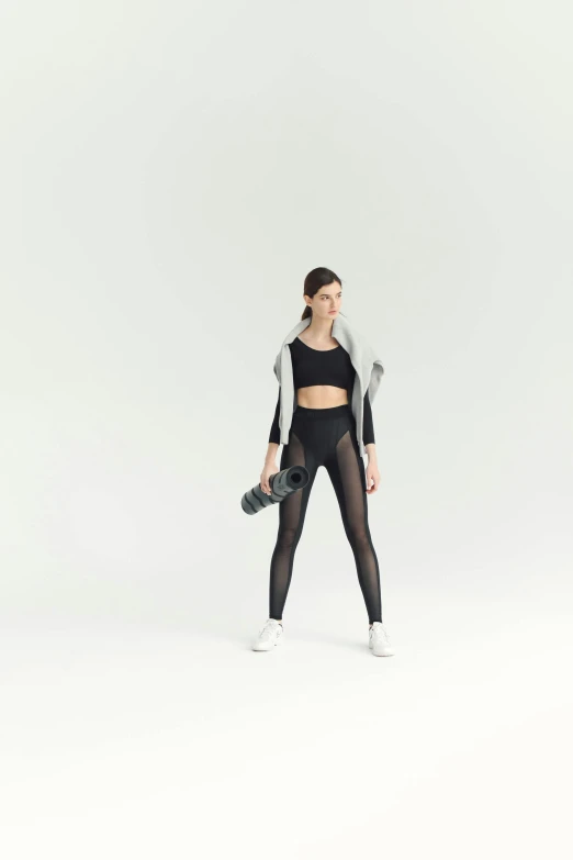 a woman in a black top and black leggings, by Nina Hamnett, pexels contest winner, holography, white background, sports bra, full body cgsociety, panoramic view of girl