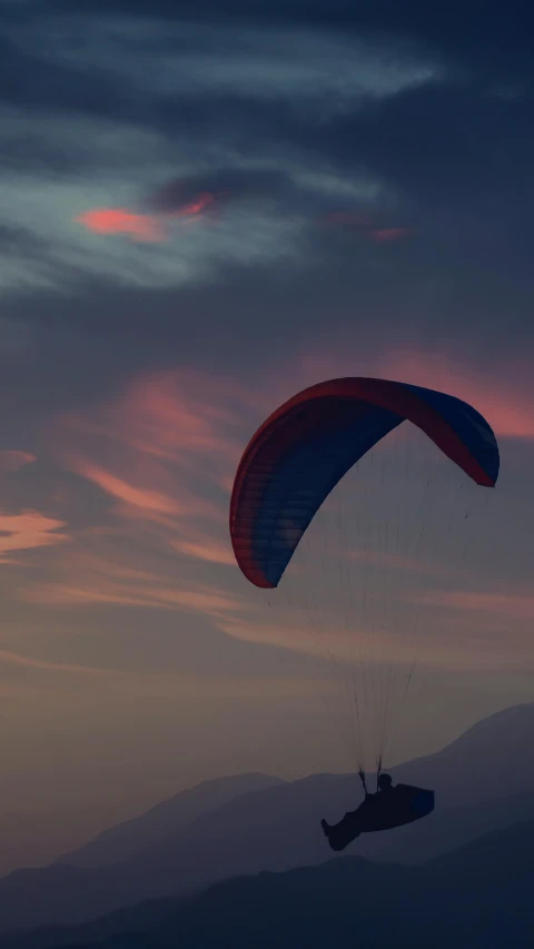 a couple of people that are flying in the sky, by Eglon van der Neer, pexels contest winner, hurufiyya, red and blue back light, late summer evening, gliding, lightweight