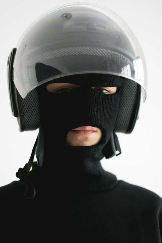 a close up of a person wearing a helmet, inspired by Zhu Da, unsplash, neo-dada, wearing turtleneck, outfit: cop, stealthy, freezing