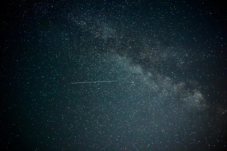 a plane is flying through the night sky, by Niko Henrichon, pexels, space art, perseides meteor shower, grainy footage, international space station, youtube thumbnail