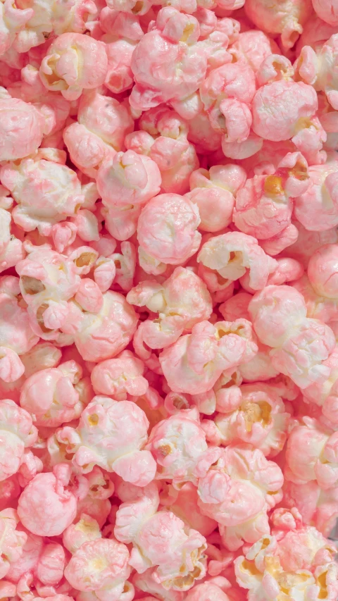 a pile of pink popcorn sitting on top of a table, inspired by Chippy, pexels, high angle close up shot, circa 1 9 9 9, ((pink)), lush