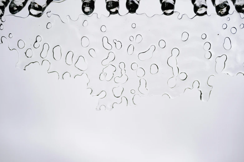 a sink filled with lots of water next to a faucet, inspired by Lucio Fontana, unsplash, floating bubbles, clear silhouette, view from below, with a white background