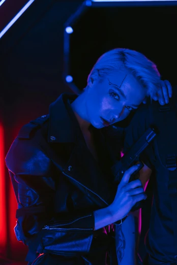 a woman standing in front of a neon sign, an album cover, inspired by Elsa Bleda, trending on pexels, short platinum hair tomboy, dramatic blue lighting, amber heard, kpop