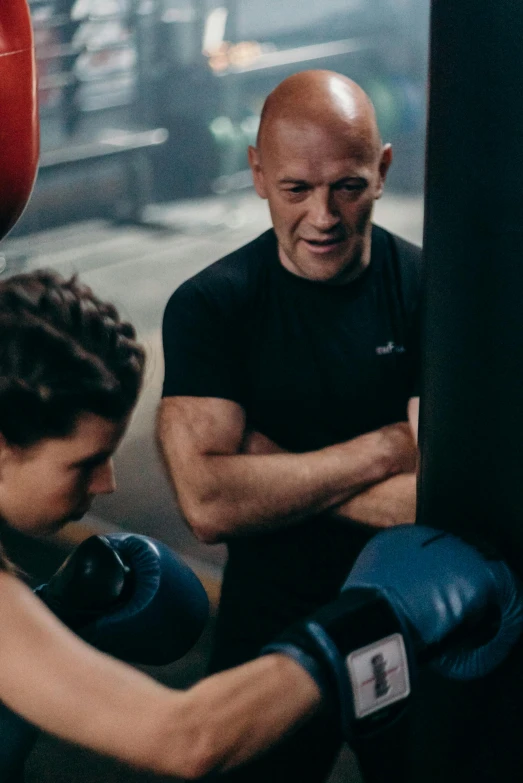 a couple of men standing next to each other near a punching bag, profile image, patrick stewart, working out, jodie bateman