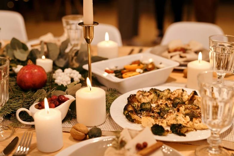 a table topped with plates of food and candles, by Carey Morris, pexels contest winner, profile image, background image, white, seasonal