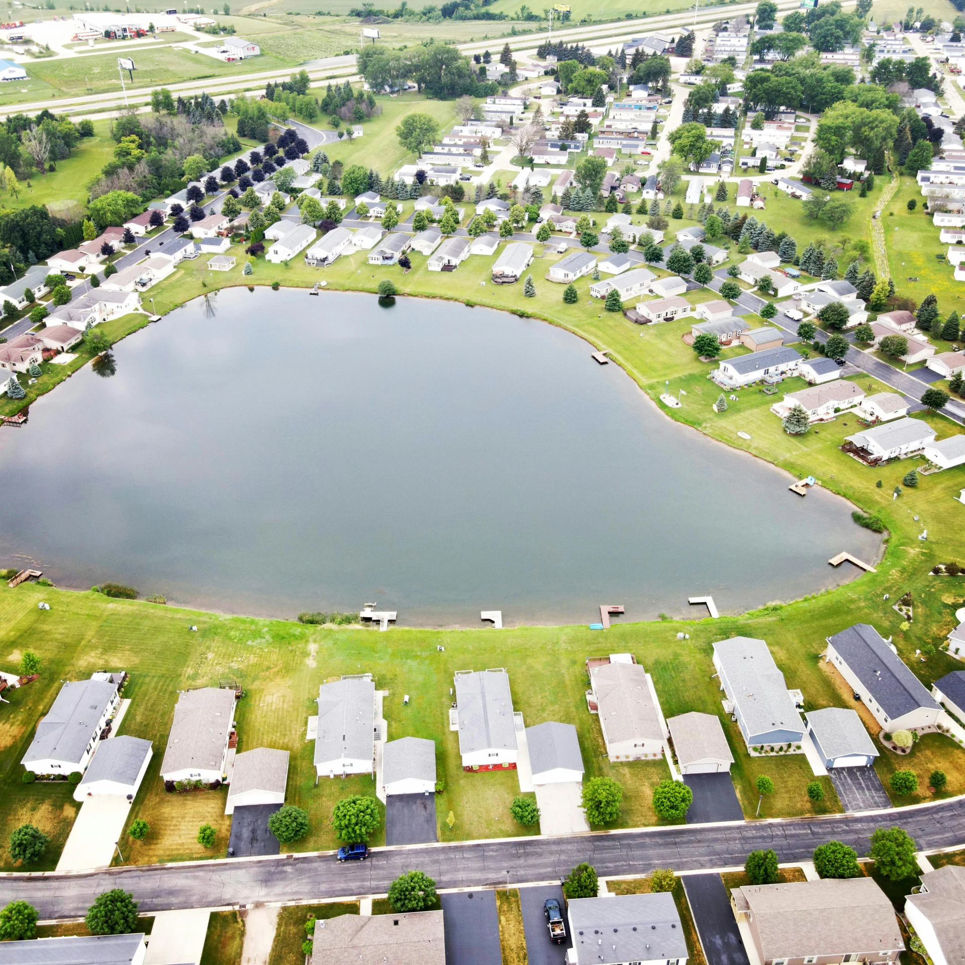 a large body of water surrounded by lots of houses, crystal lake, wayne haag, taken in 2022, discovered photo