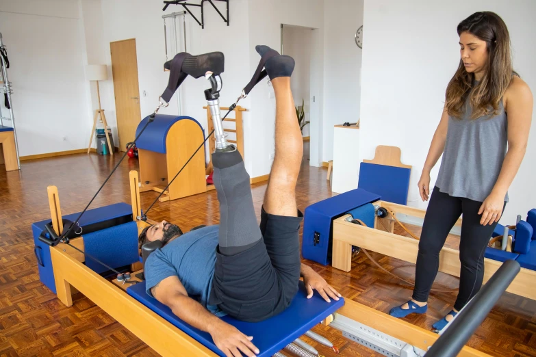 a woman standing next to a man on a pilates, by david rubín, dribble, são paulo, profile image, thumbnail, indoor picture