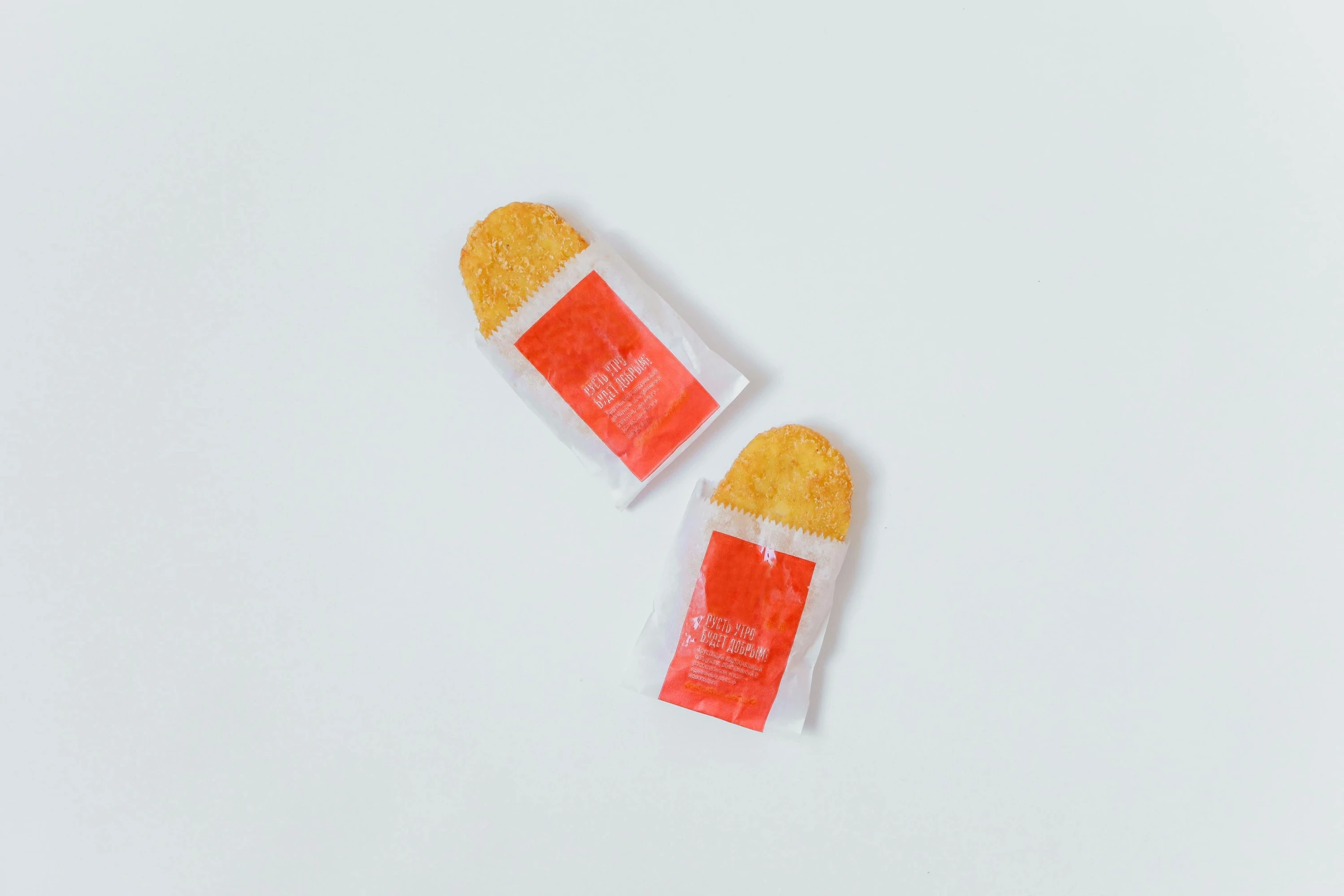 two pieces of candy sitting on top of each other, condorito, packaging, smol, flat lay