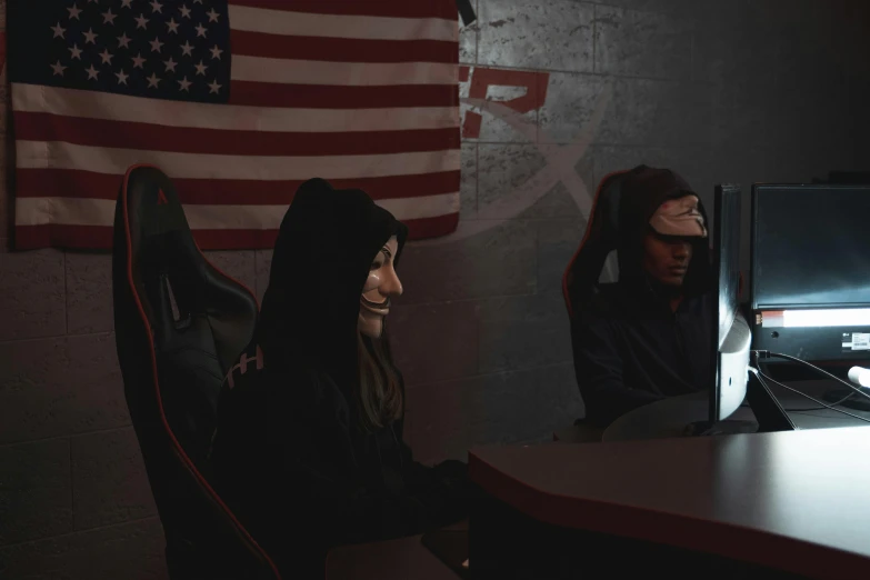 two people sitting at a desk in front of a computer, reddit, realism, wearing bandit mask, patriotism, blackout, high quality photo