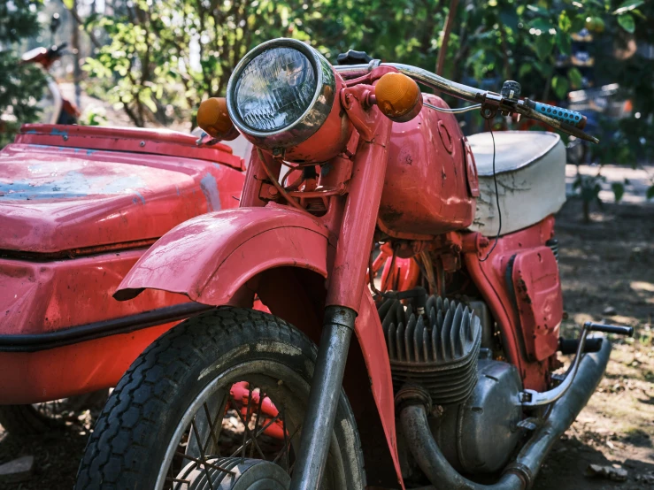 a red motorcycle parked next to a red car, pexels contest winner, photorealism, rusted junk, indian, ultra realistic classic, an old