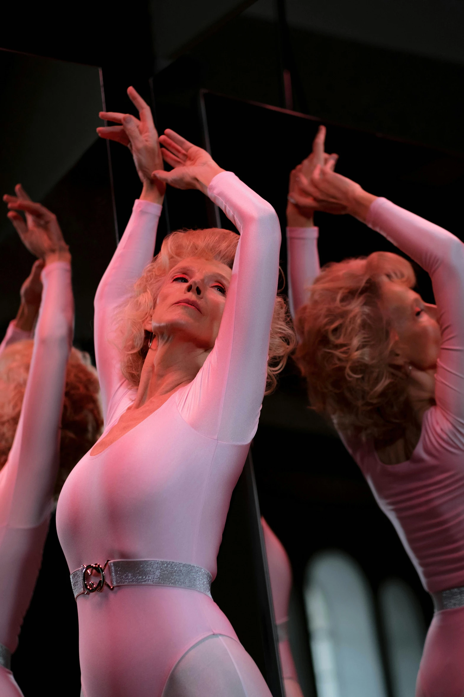 a group of women standing on top of a stage, carmen dell ’ orefice, closeup of arms, suspended in zero gravity, taken in the late 2010s