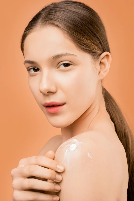 a woman with a lot of cream on her shoulder, trending on pexels, detailed product image, looking straight to camera, panoramic view of girl, silicone skin