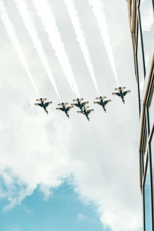 a group of jets flying in formation in the sky, a photo, by Niko Henrichon, pexels contest winner, firing it into a building, white hair floating in air, 🚿🗝📝, military parade