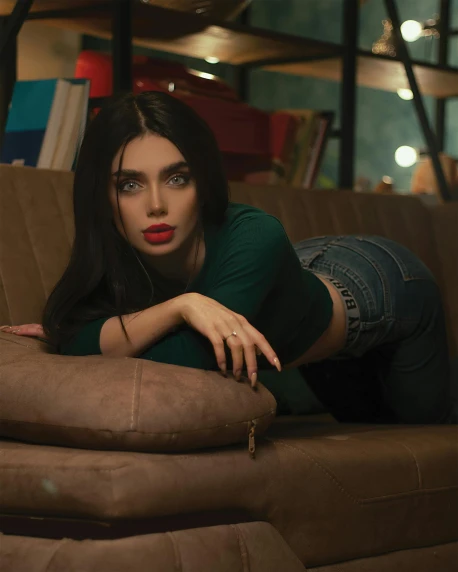 a woman laying on top of a brown couch, a colorized photo, inspired by Elsa Bleda, pexels contest winner, young beautiful amouranth, jeans, pout, high quality screenshot