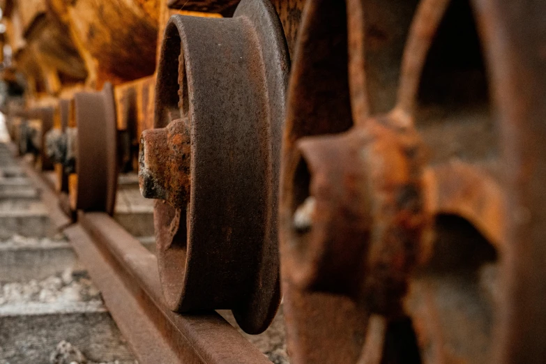 a close up of the wheels of a train, a portrait, pexels contest winner, auto-destructive art, rust background, profile picture 1024px, brown, mine cart