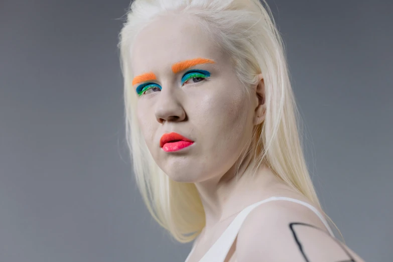 a close up of a person with bright makeup, inspired by Louisa Matthíasdóttir, albino dwarf, non binary model, full face and body portrait, idealised