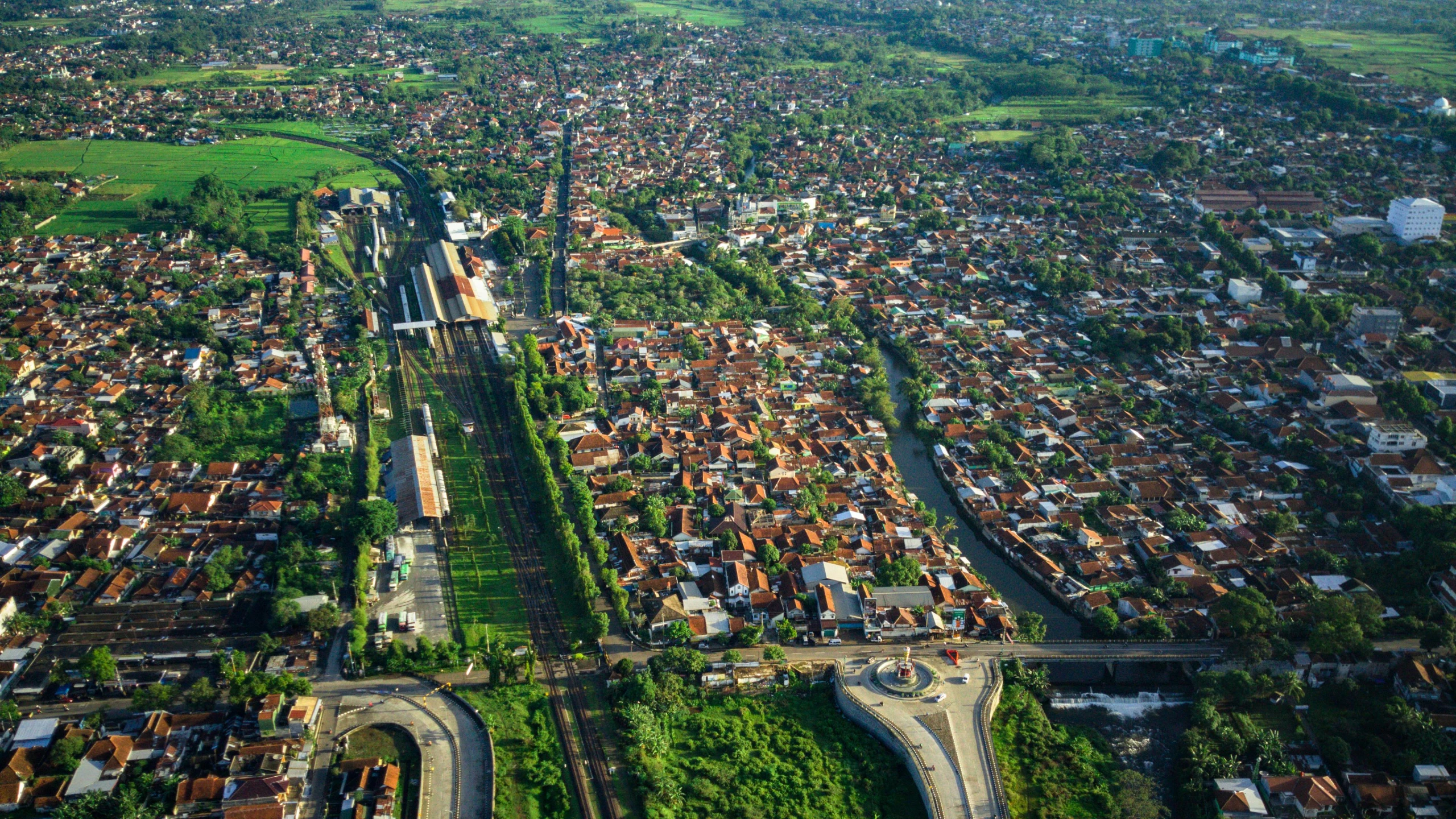 an aerial view of a city with a river running through it, by Luis Miranda, shutterstock, south jakarta, square, transylvania, long