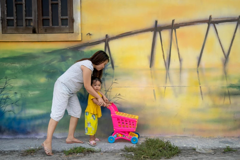 a woman pushing a child with a shopping cart, pexels contest winner, street art, mai anh tran, faux painting, square, multicoloured