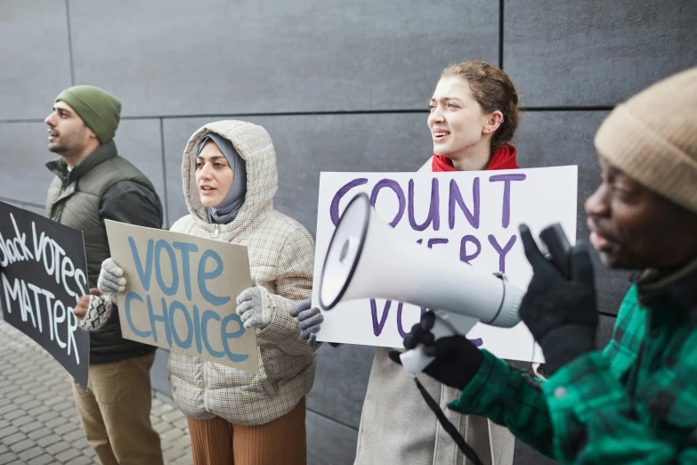 a group of people holding signs in front of a building, heavily upvoted, holding court, background image, politics