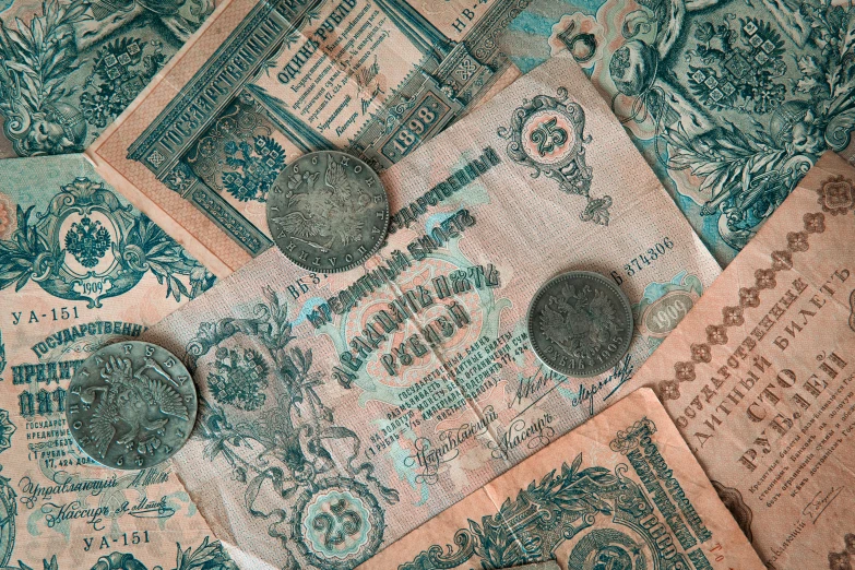 a pile of old money sitting on top of a table, by Abram Arkhipov, pexels contest winner, art nouveau, turquoise pink and green, 🦩🪐🐞👩🏻🦳, decorated with soviet motifs, thumbnail