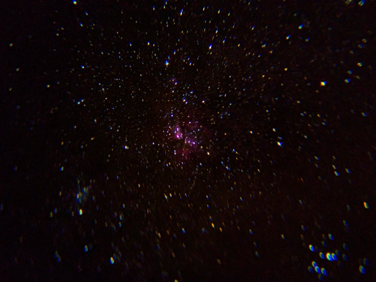 a dark sky filled with lots of stars, a microscopic photo, flickr, pink, shot on gopro9, multi - coloured, shot on sony a 7