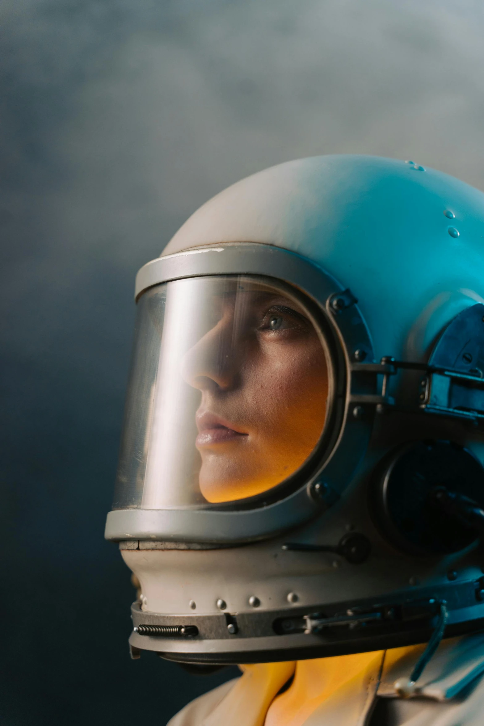 a close up of a person wearing a helmet, inspired by ridley scott, girl in space, astronaut in the ocean, redshift houdini, biopic