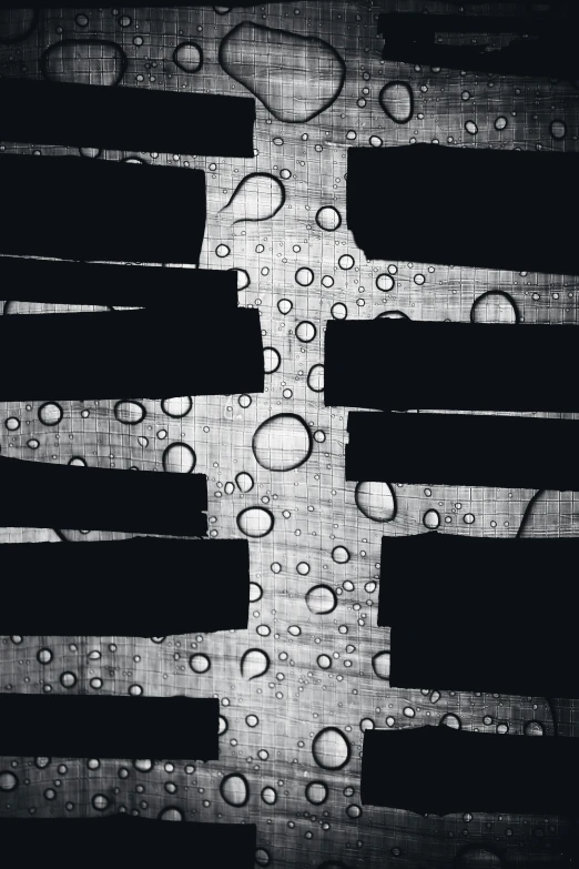 a black and white photo of water droplets on a piano keyboard, an album cover, inspired by Pierre Soulages, conceptual art, several layers of fabric, (abstract), cell bars, dark. no text