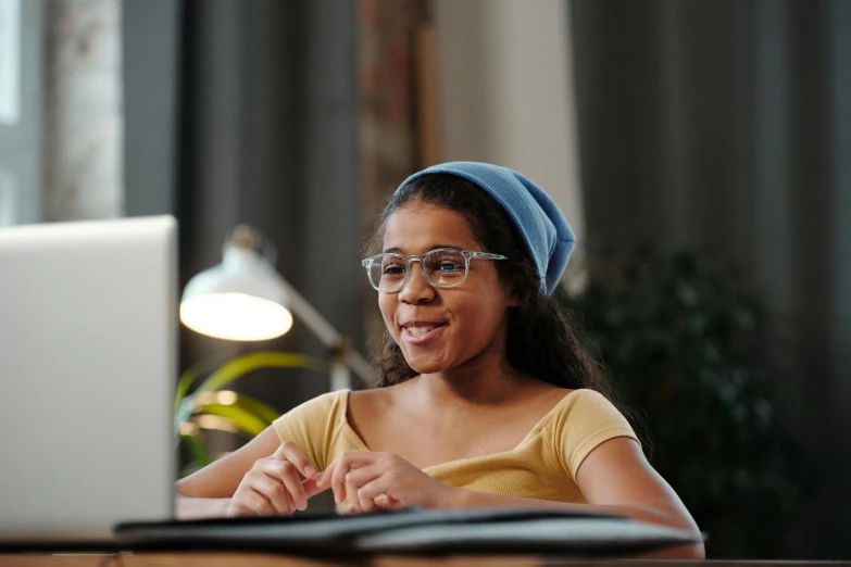 a young girl sitting in front of a laptop computer, pexels contest winner, wearing square glasses, wearing a headband, thumbnail, avatar image