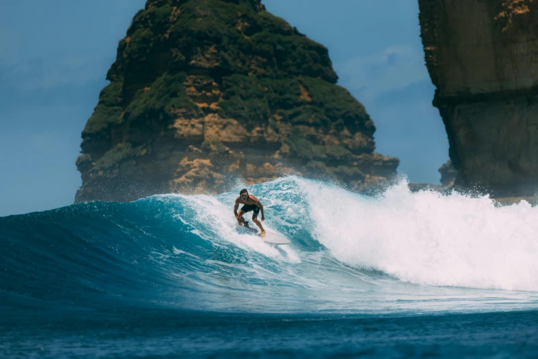 a man riding a wave on top of a surfboard, pexels contest winner, sumatraism, avatar image, cliffs, curvy build, tv still