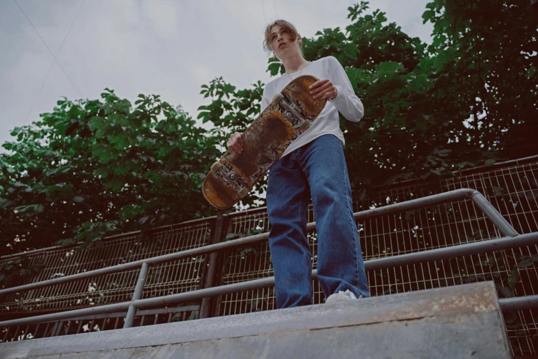 a man riding a skateboard up the side of a ramp, pexels contest winner, realism, baggy jeans, looking towards camera, tommy 1 6 years old, lo-fi