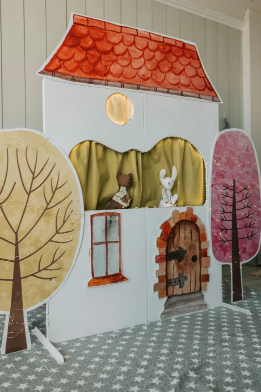 a picture of a house made out of paper, by Lucette Barker, unsplash, interactive art, fairytale forest, realistic cloth puppet, toddler, theatre stage