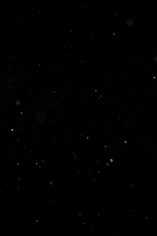 a man riding a snowboard down a snow covered slope, a picture, by Yosa Buson, glitter gif, damaged webcam image, snowstorm ::5, black sky with stars