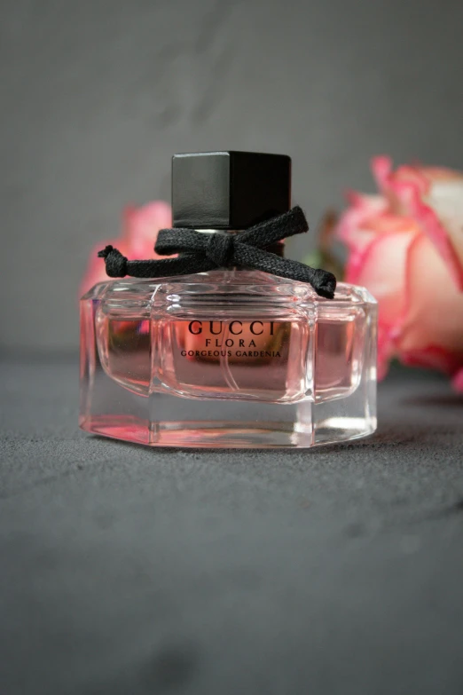 a bottle of marc marc marc marc marc marc marc marc marc marc marc marc marc marc marc, a picture, inspired by Eugène Brands, instagram, gucci goddess, closeup portrait shot, florence nightingale, on grey background