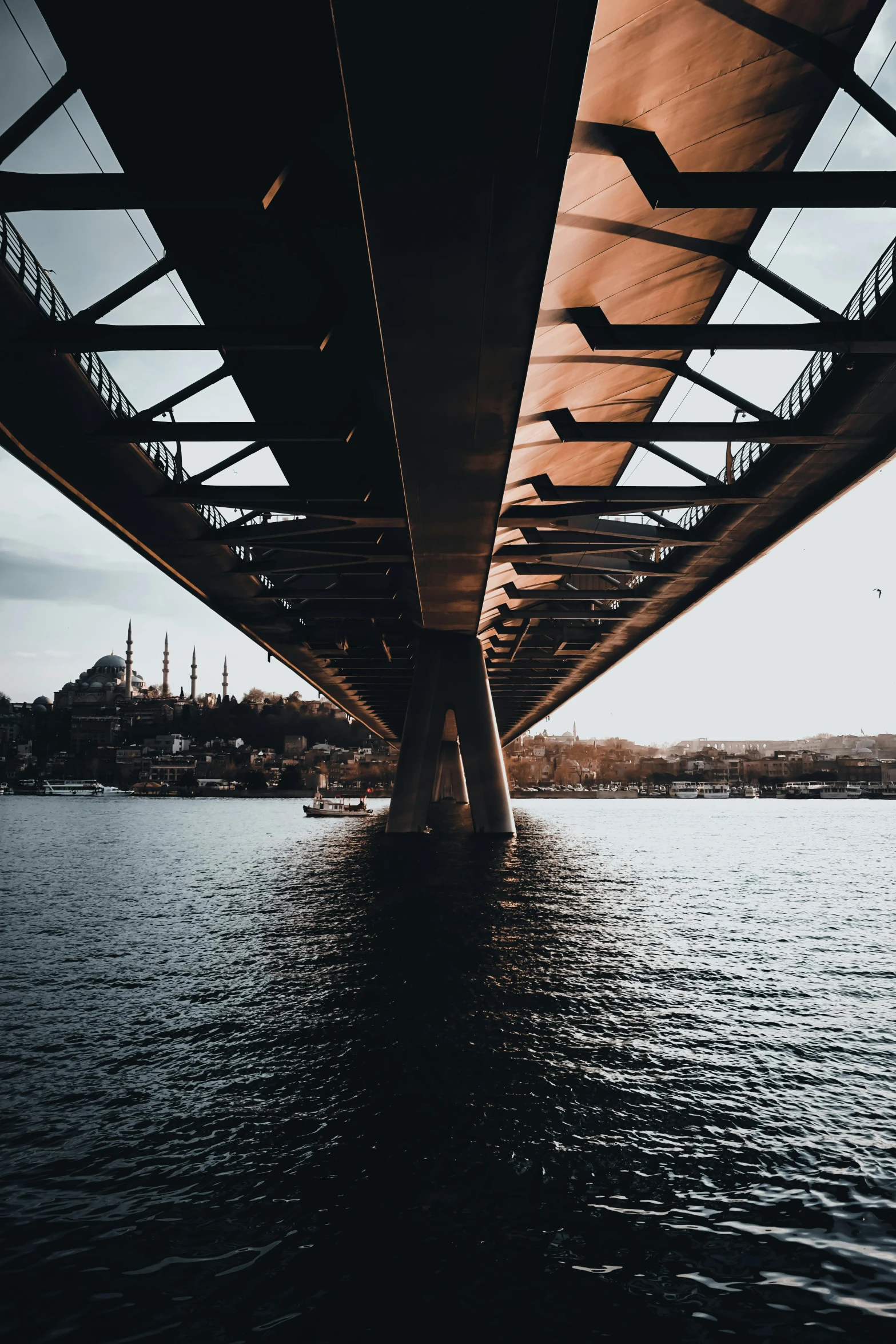 the underside of a bridge over a body of water, by irakli nadar, pexels contest winner, hyperrealism, fallout style istanbul, unsplash 4k, instagram story, towering over your view