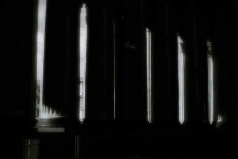a black and white photo of a row of columns, a black and white photo, lyrical abstraction, nightlight study, 1 2 0 0 dpi scan, dark ambient album cover, forks