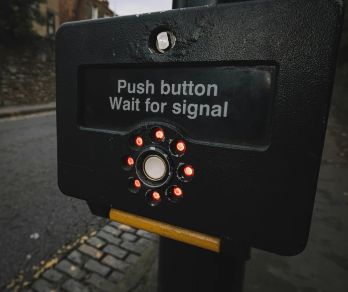 a sign that says push button wait for signal, unsplash, graffiti, square, black, ignant, paisley