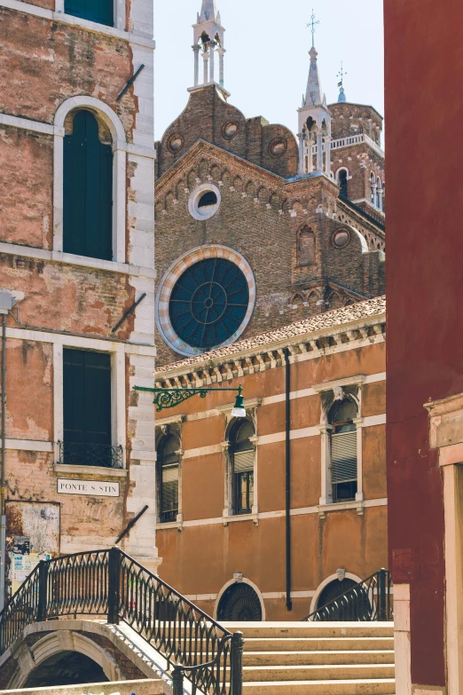 a couple of buildings that are next to each other, inspired by Quirizio di Giovanni da Murano, trending on unsplash, renaissance, brown, square, various colors, church in the background