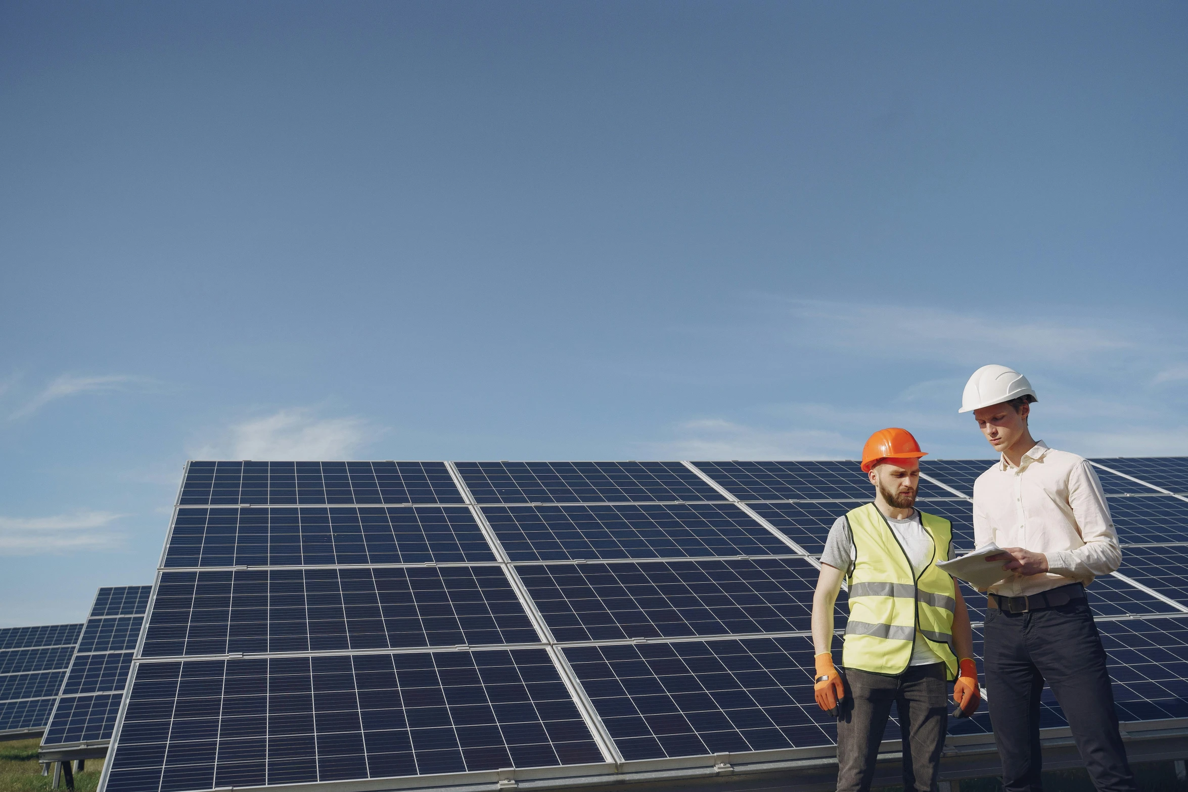 two men standing in front of solar panels, a photo, shutterstock, worksafe. cinematic, a green, avatar image, customers