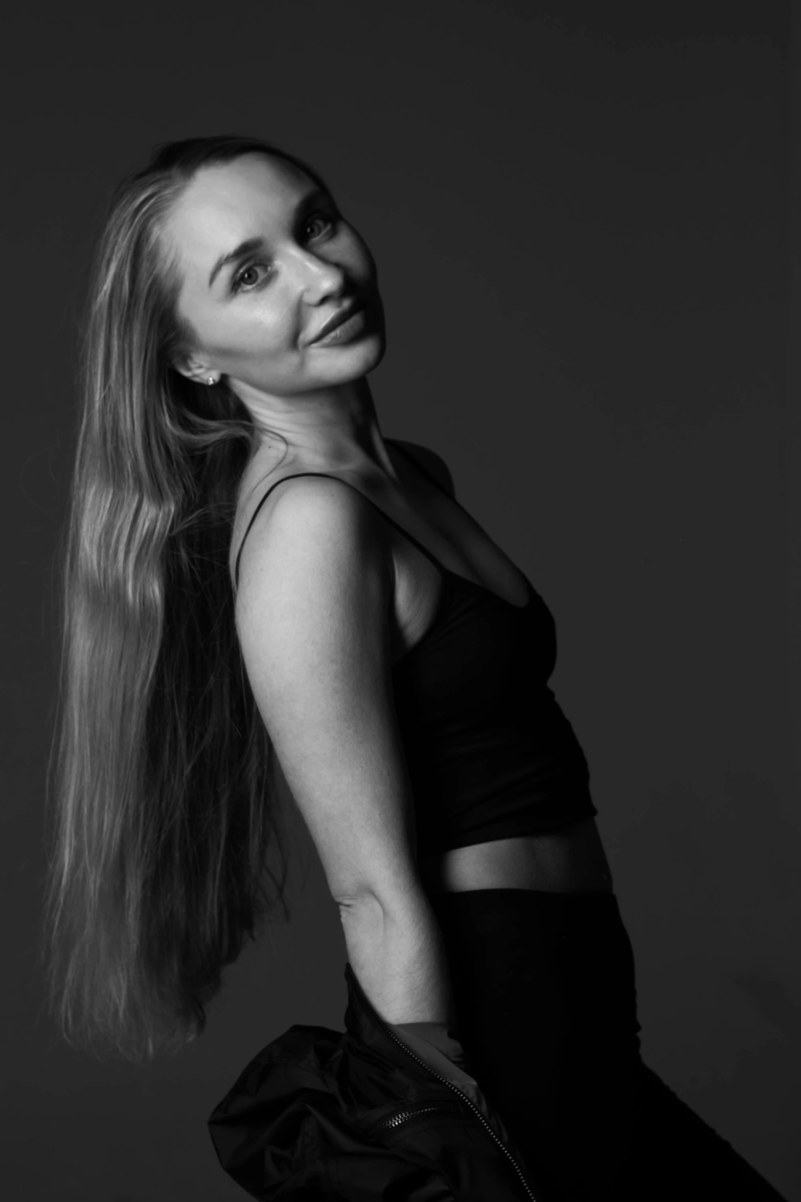 a black and white photo of a woman with long hair, a black and white photo, inspired by Louisa Matthíasdóttir, dramatic smiling pose, dark blond long hair, carole feuerman, uploaded