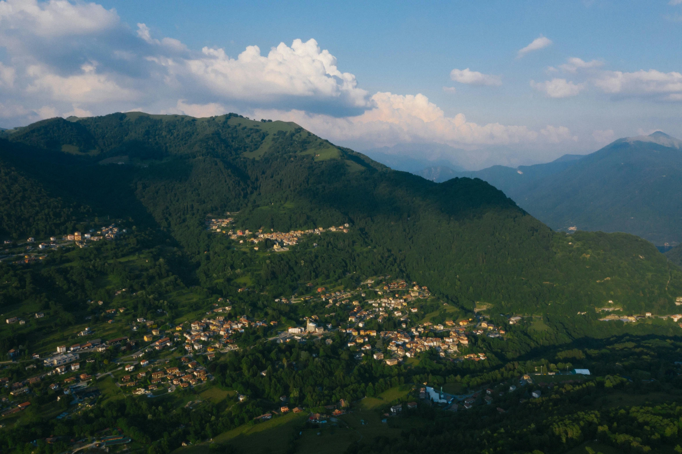 an aerial view of a small town in the mountains, by Muggur, pexels contest winner, renaissance, summer evening, lush vista, thumbnail, georgic