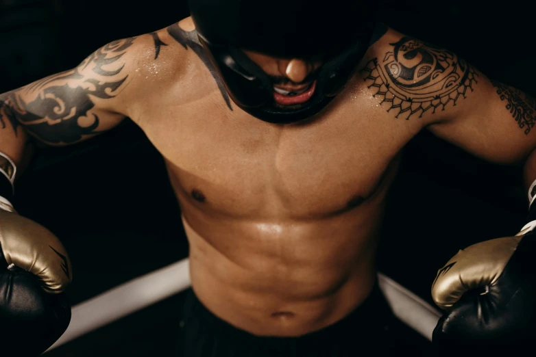 a close up of a person wearing boxing gloves, a tattoo, barrel chested, thrusters, manuka, man is with black skin