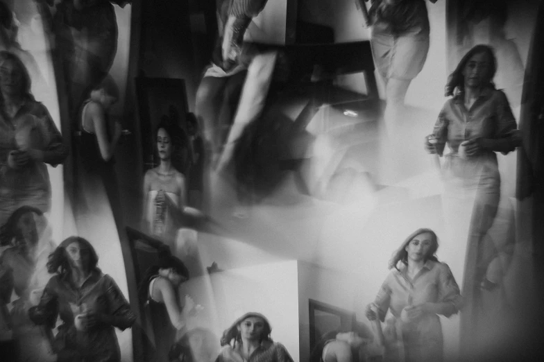 a black and white photo of a group of women, inspired by Germaine Krull, unsplash, surrealism, abstract mirrors, blurry footage, in a bedroom, holga 120n