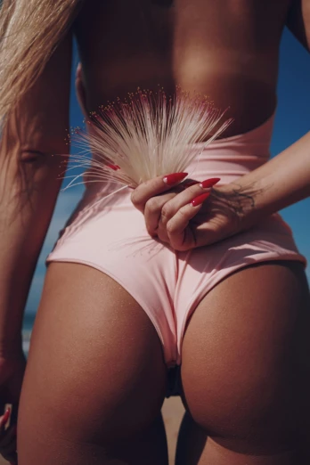 a woman standing on top of a sandy beach, inspired by Ren Hang, magic realism, long spiky pink hair, thighs close up, blond furr, woman holding another woman
