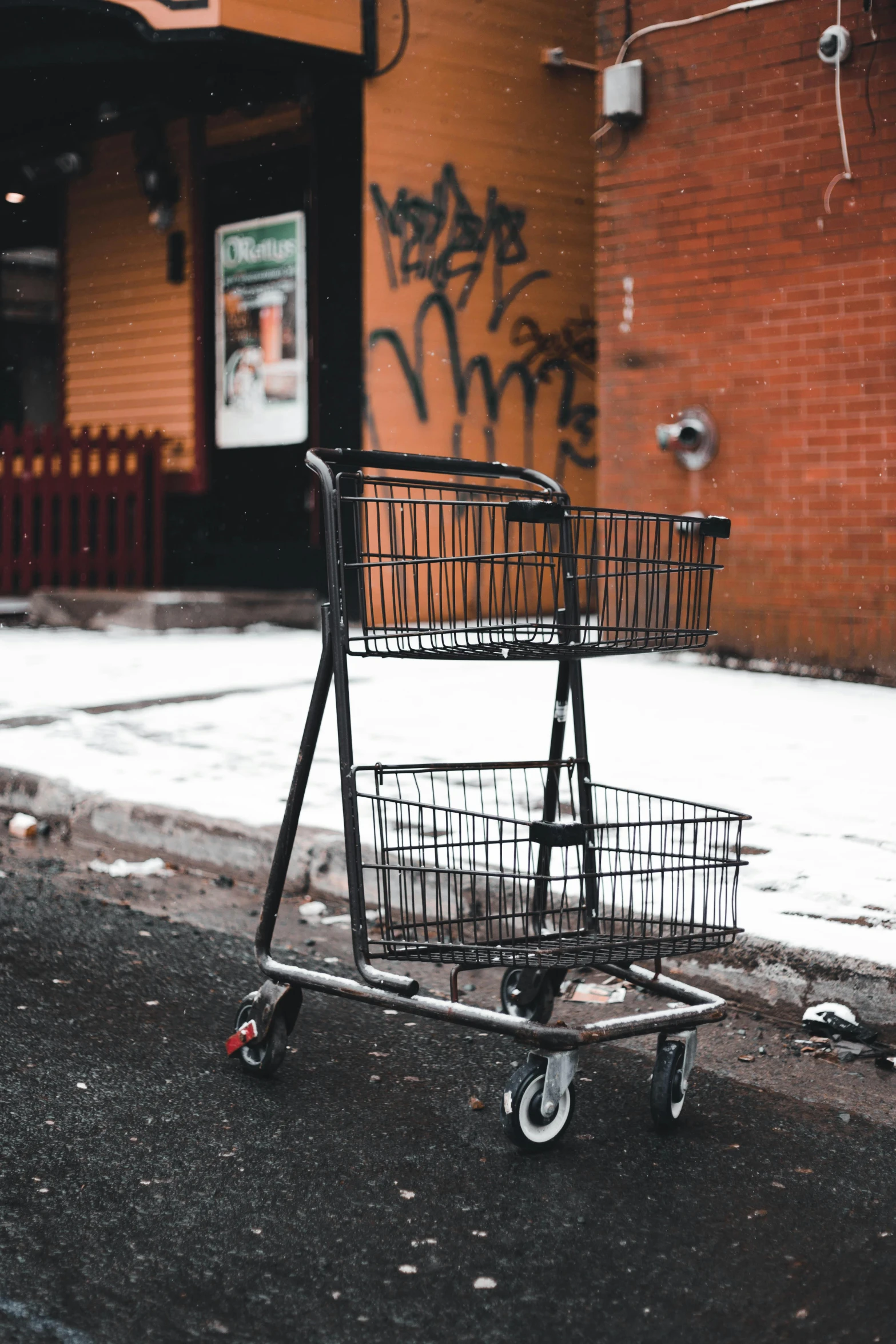 a shopping cart sitting on the side of a street, by Greg Rutkowski, unsplash, graffiti, winter, standing in township street, old fashion, corners