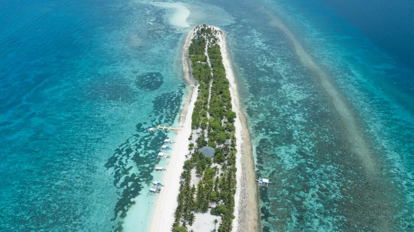 an aerial view of an island in the middle of the ocean, by Robbie Trevino, pexels contest winner, hurufiyya, beachfront mansion, thumbnail, philippines, mario testino