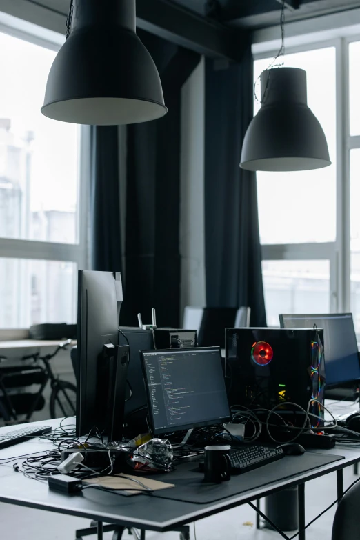 a group of computers sitting on top of a table, light and dark, hyperthreading, maintenance, on desk