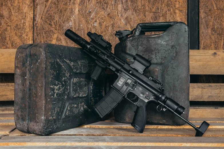 a gun sitting on top of a wooden bench, holding pdw, platforms, background image, all black matte product