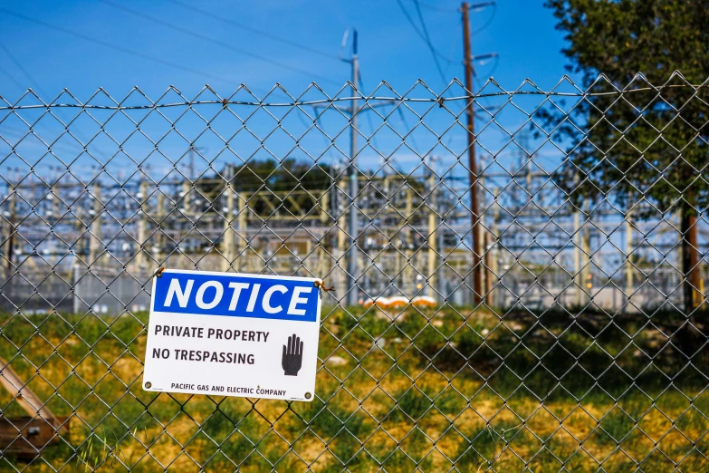 a fence with a sign that says notice private property no trespassing, by Bernie D’Andrea, unsplash, graffiti, power plants, high voltage warning sign, 15081959 21121991 01012000 4k, instagram photo